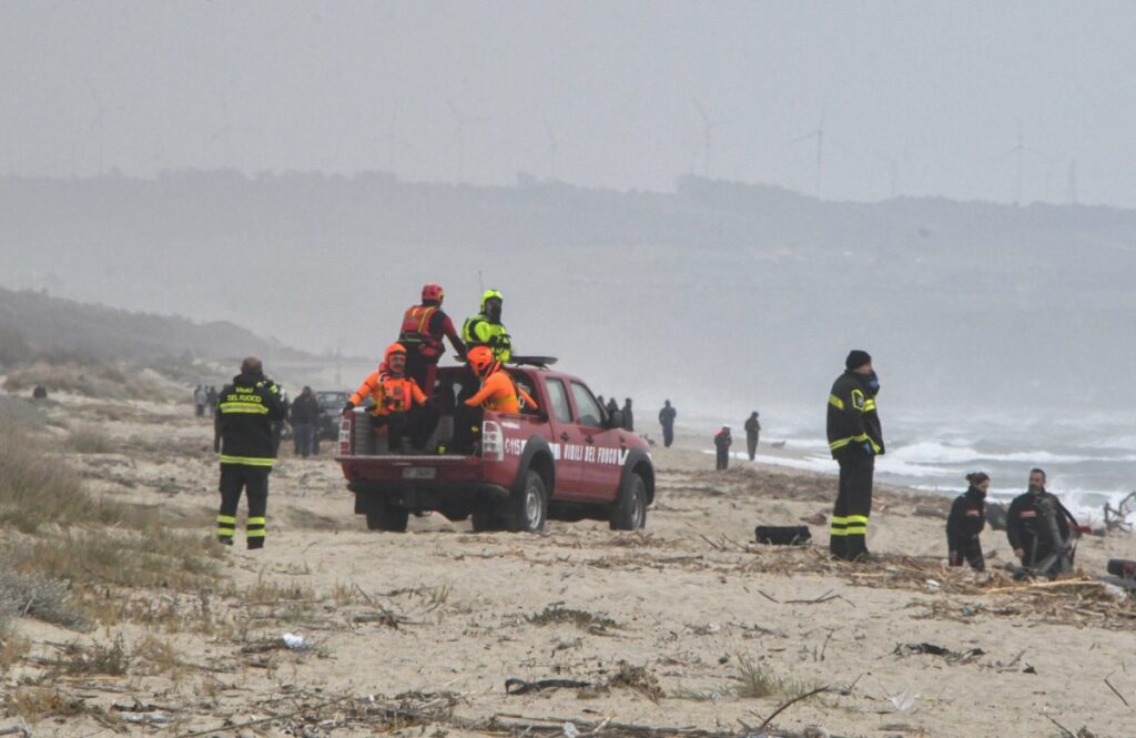 Rescuers arrive at the beach where bodies believed to be of refugees were found after a shipwreck, in Cutro, the eastern coast of Italy's Calabria region, Italy, February 26, 2023.