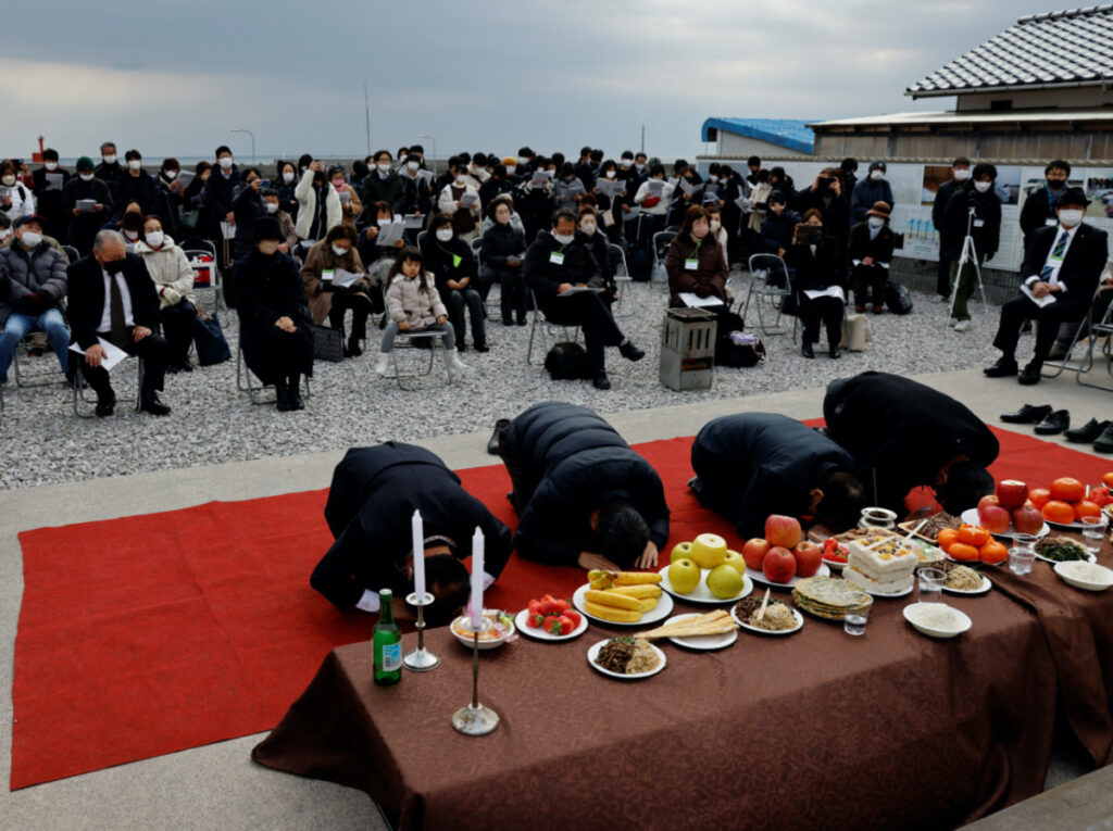 South Korean relatives of workers killed in a disaster at the Chosei coal mine, bow toward an altar for the victims at a mourning ceremony, in Ube, Yamaguchi Prefecture, Japan, February 4, 2023.