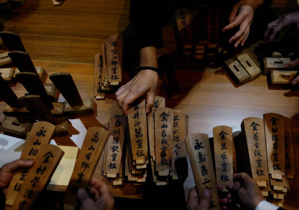 FIE PHOTO: South Korean relatives of workers killed in a disaster at the Chosei coal mine, sort out ancestral tablets for the victims at a temple in Ube, Yamaguchi Prefecture, Japan, February 4, 2023.