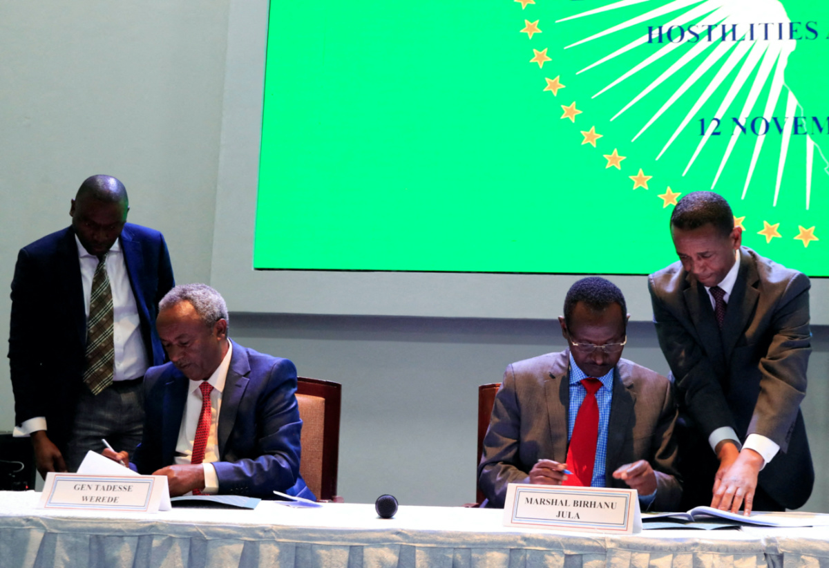 FILE PHOTO: Field Marshal of the Ethiopian National Defence Force and Chief of General Staff of Ethiopia Birhanu Jula, and Tadesse Werede Tesfay, the Commander-in-Chief of the Tigray forces, sign the implementation of the cessation of hostilities agreement between the Ethiopian government and Tigrayan forces, laying out the roadmap for implementation of a peace deal, in Nairobi, Kenya November 12, 2022. REUTERS/Thomas Mukoya/File Photo