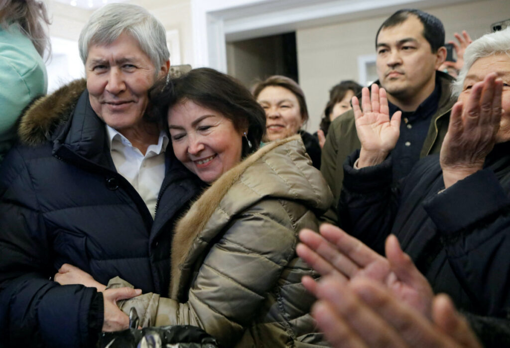 Kyrgyzstan's former president Almazbek Atambayev hugs his wife Raisa after being released from prison for medical treatment abroad, at his residence in the village of Koy-Tash near Bishkek, Kyrgyzstan February 14, 2023. REUTERS/Vladimir Pirogov