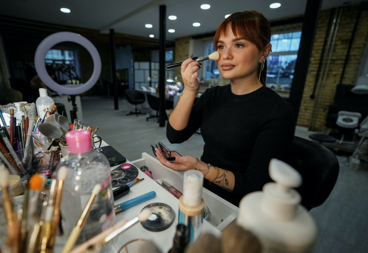 Anastasiia Subacheva, a make-up artist, works in Vilnius, Lithuania February 6, 2023. Iryna Filkina, 52, who was shot dead by Russian soldiers while riding a bicycle on her way back home in Bucha, was identified by Anastasia, who recognized the pink and purple heart emblazoned on one of her nails. A shocking photograph of a dead woman's hand with red nail varnish captured the horrors of Russia's invasion of Ukraine. REUTERS/Janis Laizans