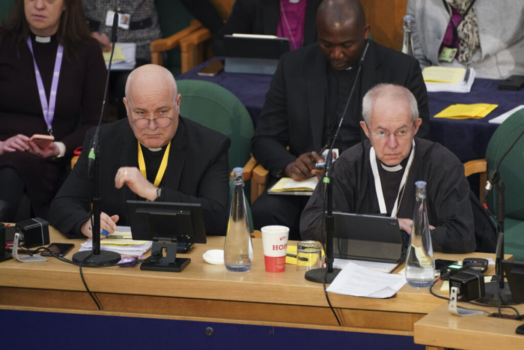 The Archbishop of York, Stephen Cottrell, left and The Archbishop of Canterbury, Justin Welby, gather at the General Synod of the Church of England, at Church House in London, Thursday, Feb. 9, 2023.