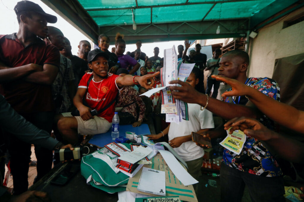 People react during the counting process of Nigeria's presidential election, at a polling unit in Awka, Anambra state, Nigeria February 25, 2023.