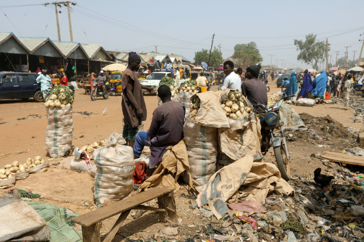 People stand in a market in Gusau, Zamfara, Nigeria, February 8, 2023. REUTERS/Temilade Adelaja