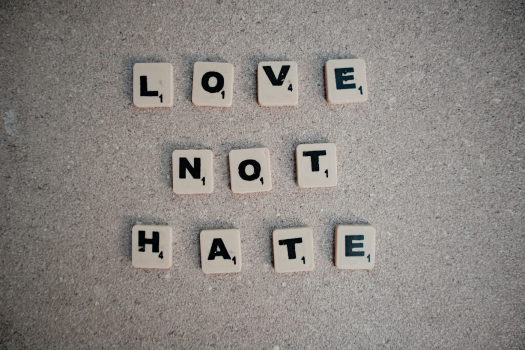 Scrabble tiles Love not Hate