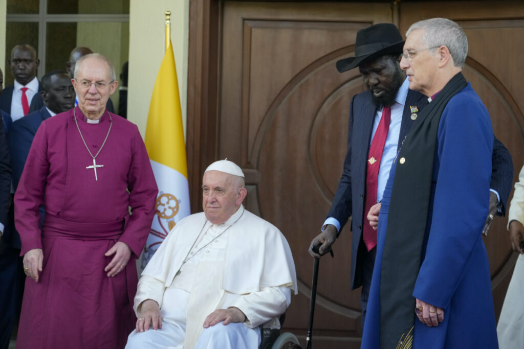 From left, the Archbishop of Canterbury Justin Welby, Pope Francis, South Sudan's President Salva Kiir and the Moderator of the General Assembly of the Church of Scotland Iain Greenshields arrive at Juba's Presidential Palace, South Sudan, Friday, Feb. 3, 2023. Francis is in South Sudan on the second leg of a six-day trip that started in Congo, hoping to bring comfort and encouragement to two countries that have been riven by poverty, conflicts and what he calls a "colonialist mentality" that has exploited Africa for centuries. (AP Photo/Gregorio Borgia)