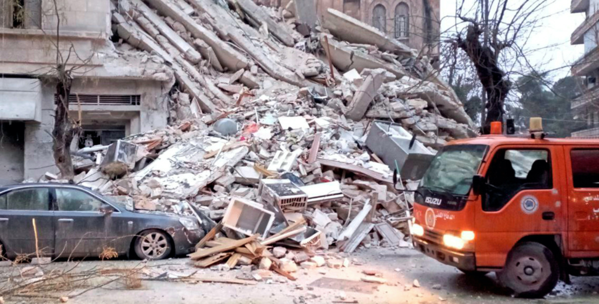 A civil defence vehicle is seen near rubble, following an earthquake, in Aleppo, Syria, in this handout released by SANA on February 6, 2023. SANA/Handout via REUTERS