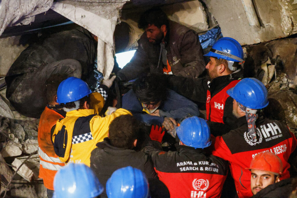 A survivor is carried on a stretcher after being rescued following an earthquake in Antakya, Hatay province, Turkey February 7, 2023.