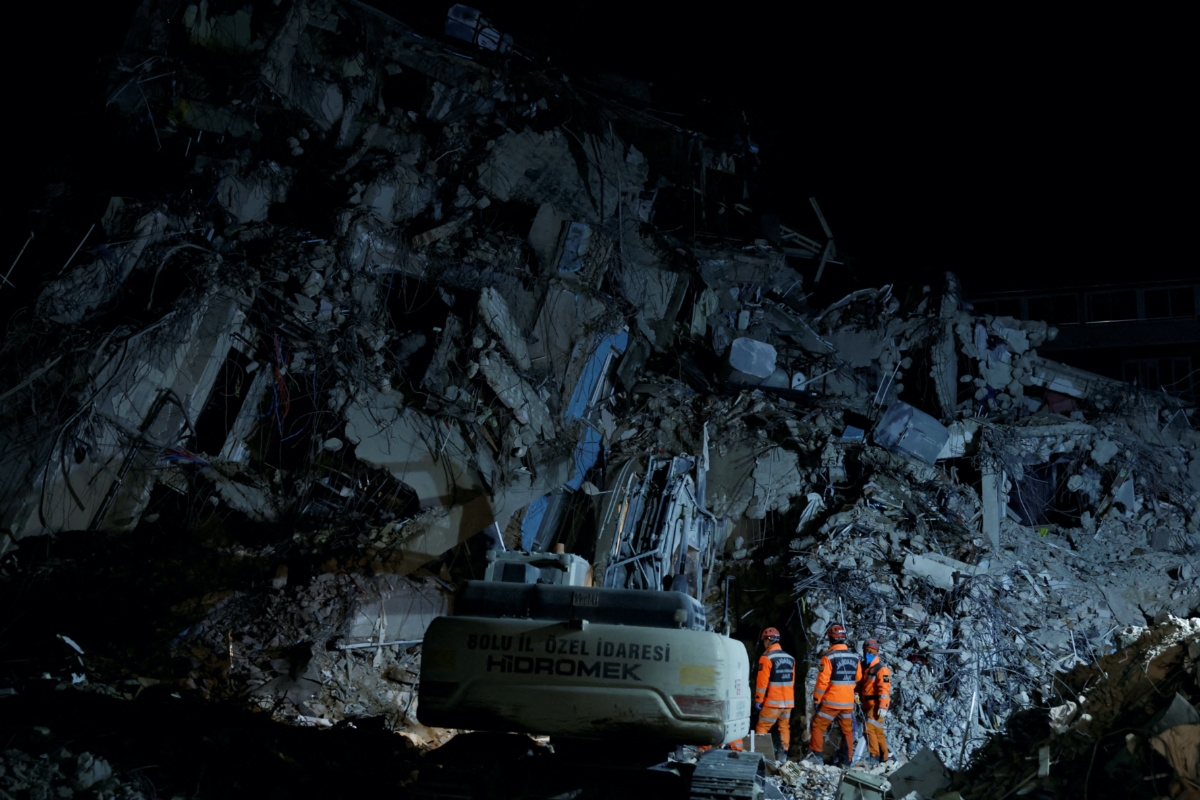Emergency workers search through rubble for the bodies of a mother and child, in the aftermath of a deadly earthquake, in Antakya, Hatay province, Turkey, February 21, 2023. 