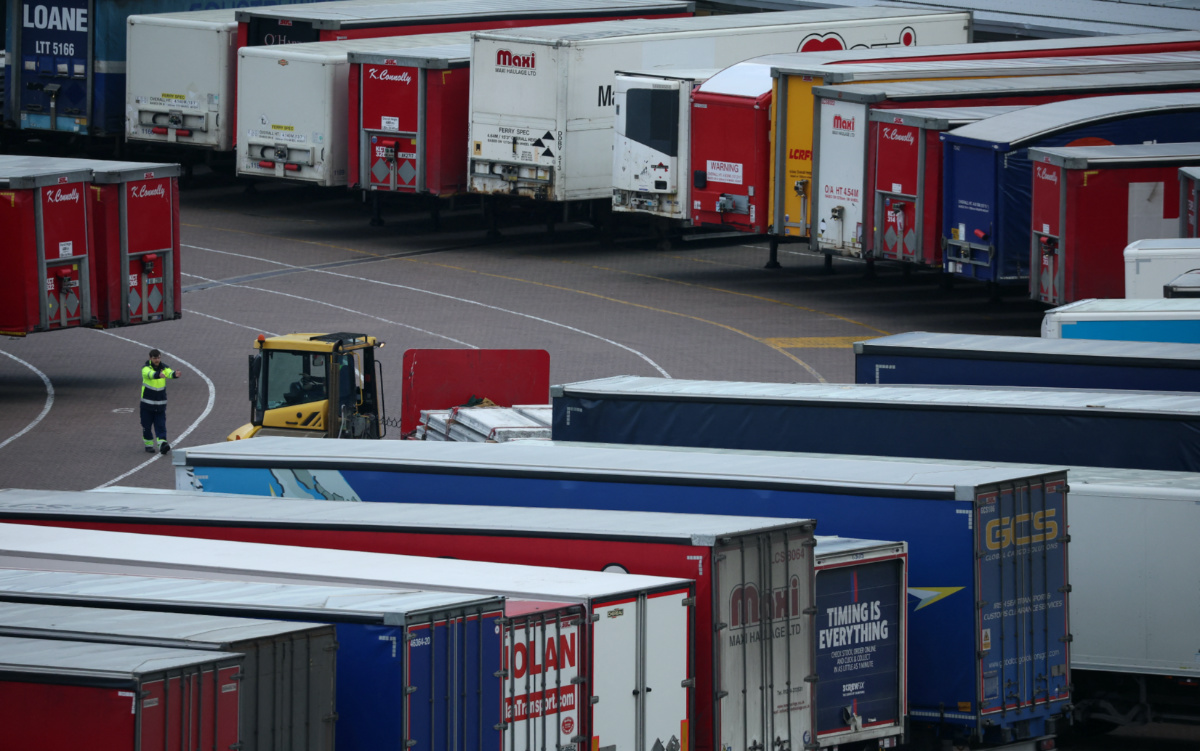 A port worker looks at lorry trailers at the port of Holyhead in Wales, Britain, February 27, 2023. 