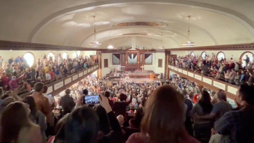 People attend a revival in Hughes Memorial Auditorium on the campus of Asbury University in Wilmore, Kentucky.