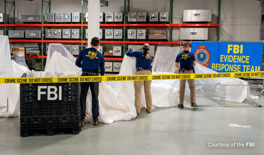 FILE PHOTO: An undated U.S. Federal Bureau of Investigation handout photo taken at an undisclosed location shows FBI Special Agents assigned to the bureau’s Evidence Response Team processing material recovered from the high-altitude Chinese balloon that was shot down by a U.S. military jet off the coast of South Carolina, in this image released by the FBI on February 9, 2023. FBI/Handout via Reute