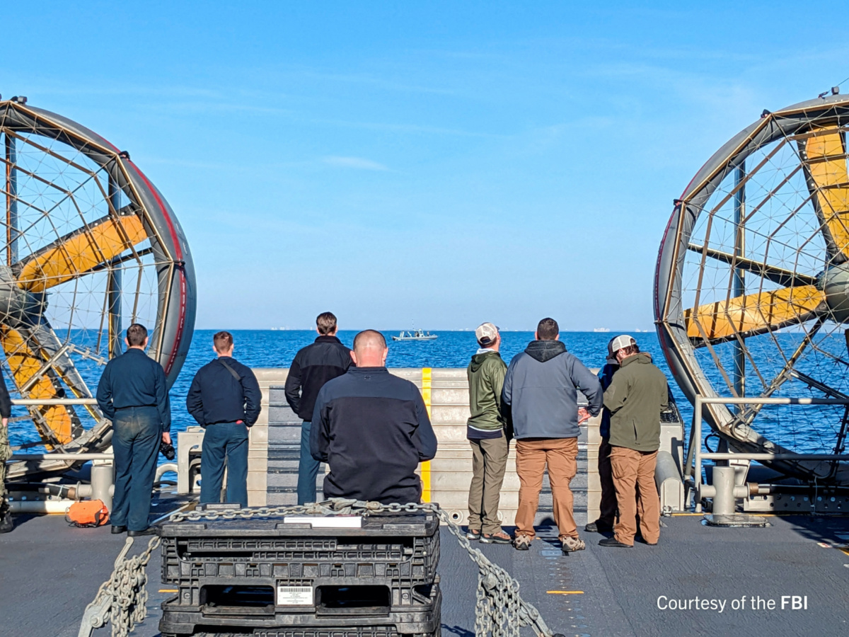 FILE PHOTO: An undated U.S. Federal Bureau of Investigation handout photo taken aboard the USS Carter Hull off South Carolina shows FBI Special Agents assigned to the bureau’s Evidence Response Team ready to process material recovered from the high-altitude Chinese balloon that was shot down by a U.S. military jet off the coast of South Carolina, in this image released by the FBI in Washington, U.S. February 9, 2023.  FBI/Handout via Reute