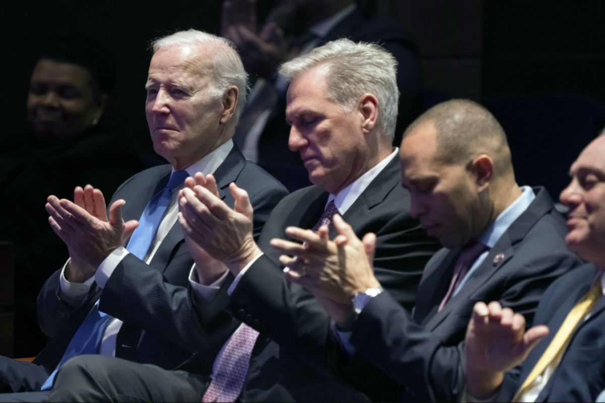 From left, President Joe Biden, Speaker of the House Kevin McCarthy of Calif., House Minority Leader Hakeem Jeffries of N.Y., and House Majority Leader Steve Scalise, R-La., applaud during a sermon as they sit together at the National Prayer Breakfast, at the Capitol in Washington, Thursday, Feb. 2, 2023. (AP Photo/J. Scott Applewhite)