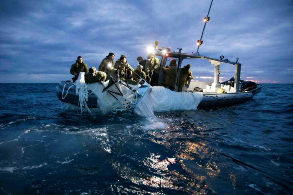 FILE PHOTO: Sailors assigned to Explosive Ordnance Disposal Group 2 recover a suspected Chinese high-altitude surveillance balloon that was downed by the United States over the weekend over U.S. territorial waters off the coast of Myrtle Beach, South Carolina, U.S., February 5, 2023. U.S. Fleet Forces/U.S. Navy photo/Handout via REUTERS