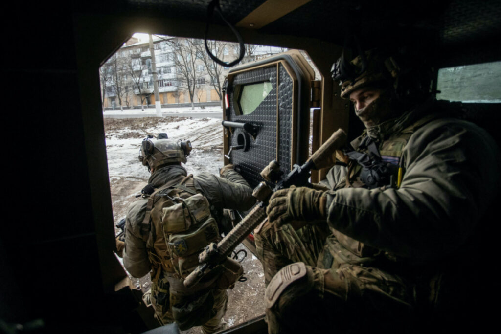 Ukrainian servicemen exit an armoured personnel carrier, amid Russia's attack on Ukraine, in the frontline town of Bakhmut, in Donetsk region, Ukraine February 9, 2023. REUTERS/Yevhenii Zavhorodnii
