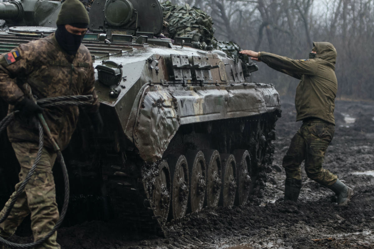 FILE PHOTO: Ukrainian service members are seen next an infantry fighting vehicle near the frontline town of Bakhmut, amid Russia's attack on Ukraine, in Donetsk region, Ukraine February 25, 2023. REUTERS/Yan Dobronosov