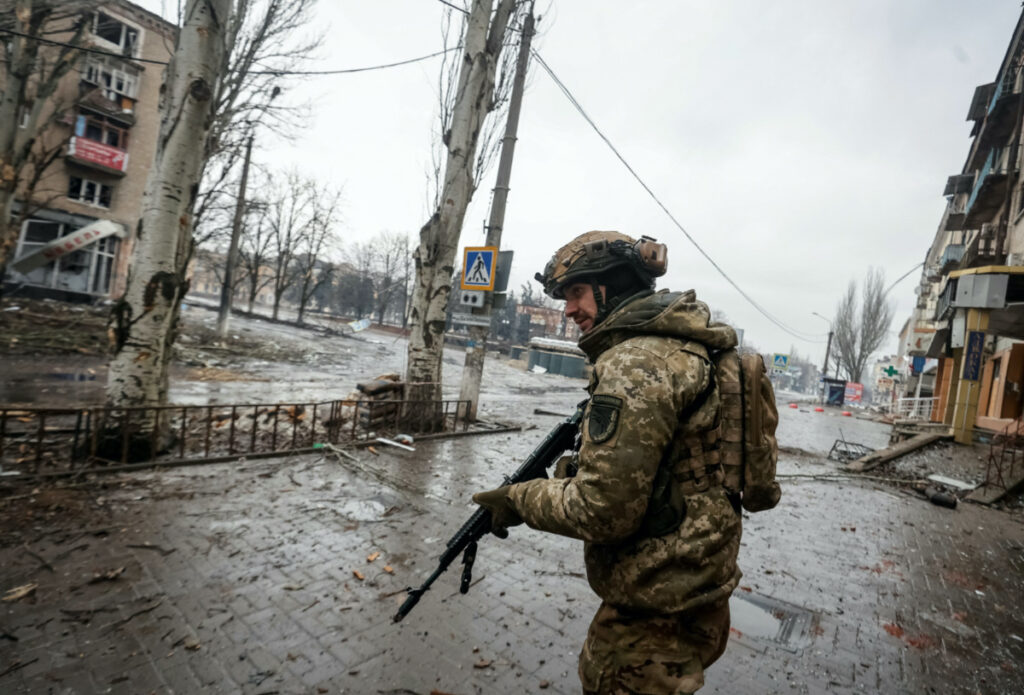 FILE PHOTO: A Ukrainian serviceman walks an empty street, as Russia's attack on Ukraine continues, in the front line city of Bakhmut, in Donetsk region, Ukraine February 25, 2023. Radio Free Europe/Radio Liberty/Serhii Nuzhnenko via REUTERS THIS IMAGE HAS BEEN SUPPLIED BY A THIRD PARTY.