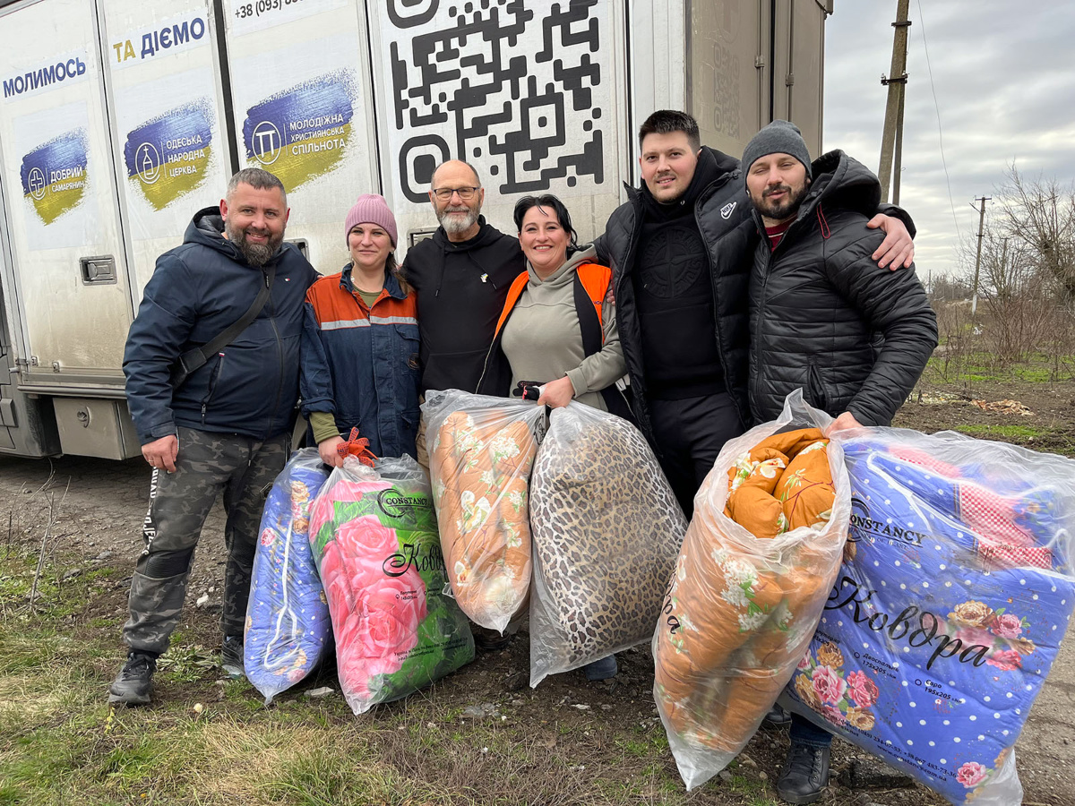 Ken Ward, third from left, poses with members of Odessa Peoples Church and aid recipients in Pervomayskoe Village on Jan 19, 2023, in Ukraine. 