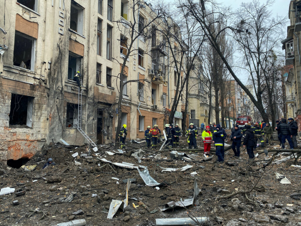 Rescuers work at a site of a residential building damaged by a Russian missile strike, amid Russia's attack on Ukraine, in central Kharkiv, Ukraine February 5, 2023.