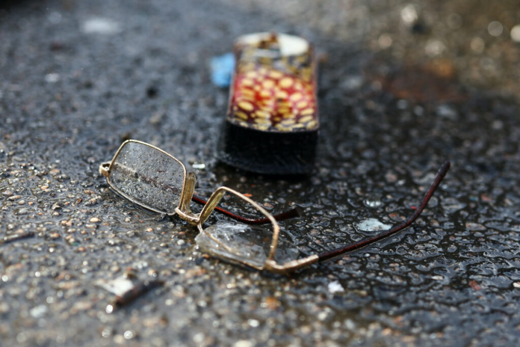 FILE PHOTO: Damaged glasses lie on the ground at a bus station destroyed after a shelling, amid Russia's attack on Ukraine, in Kherson, Ukraine February 21, 2023. REUTERS/Lisi Niesner