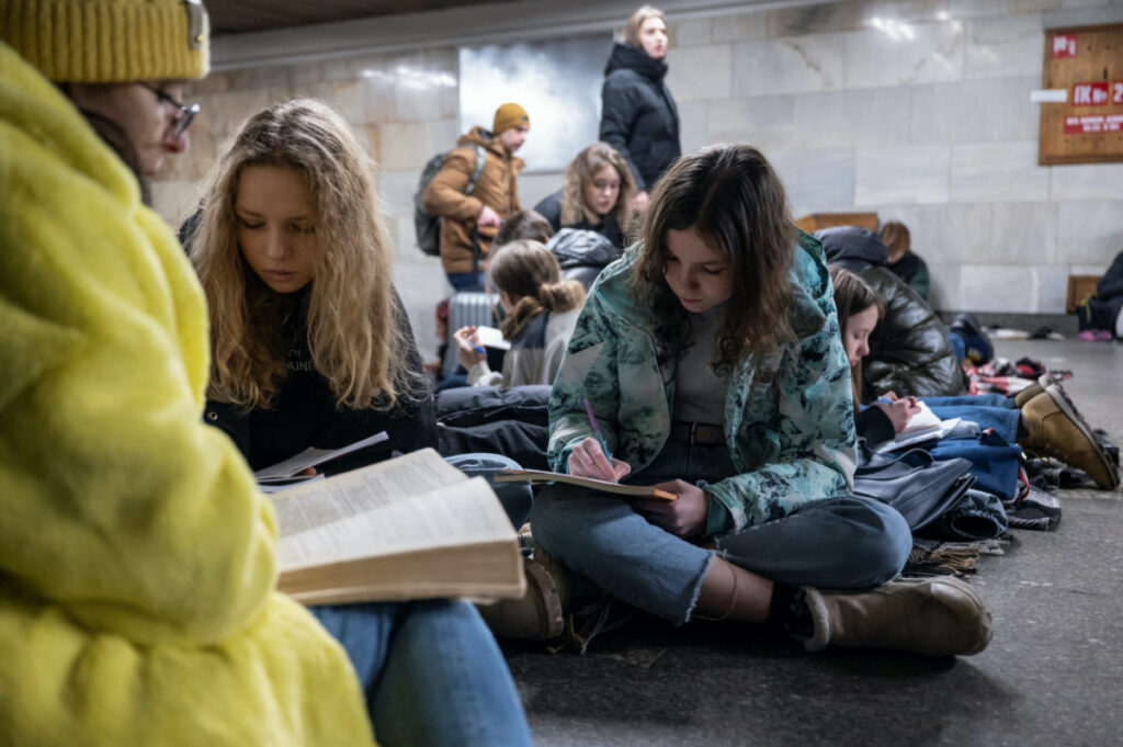 FILE PHOTO: School students attend a lesson as they take shelter inside a metro station during massive Russian missile attacks in Kyiv, Ukraine February 10, 2023. REUTERS/Viacheslav Ratynskyi/File Photo