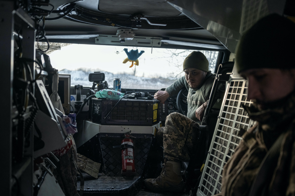 Ukrainian servicemen of the 80th Air Assault Brigade sit inside a Bushmaster Protected Mobility Vehicle, amid Russia's attack on Ukraine, near Bahmut, Donetsk region, Ukraine, February 16, 2023. 