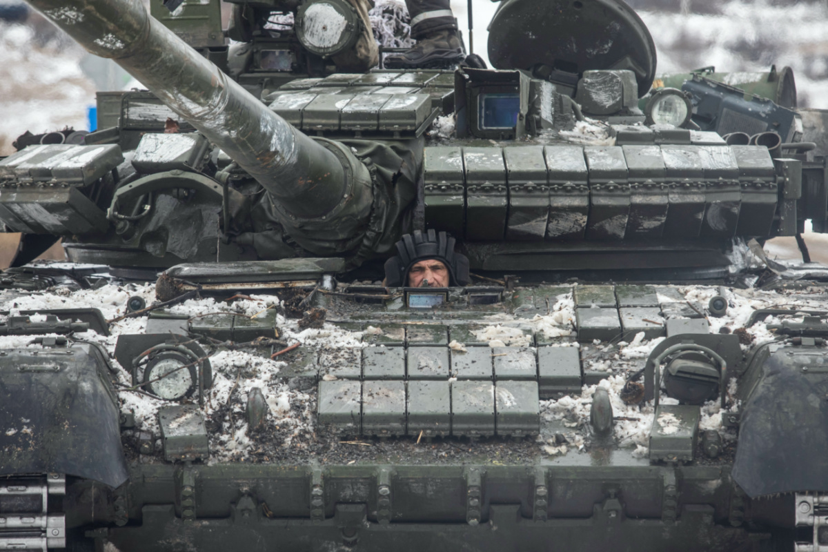 A Ukrainian serviceman drives a tank along a road outside the frontline town of Bakhmut, amid Russia's attack on Ukraine, in Donetsk region, Ukraine February 14, 2023. REUTERS/Yevhenii Zavhorodnii