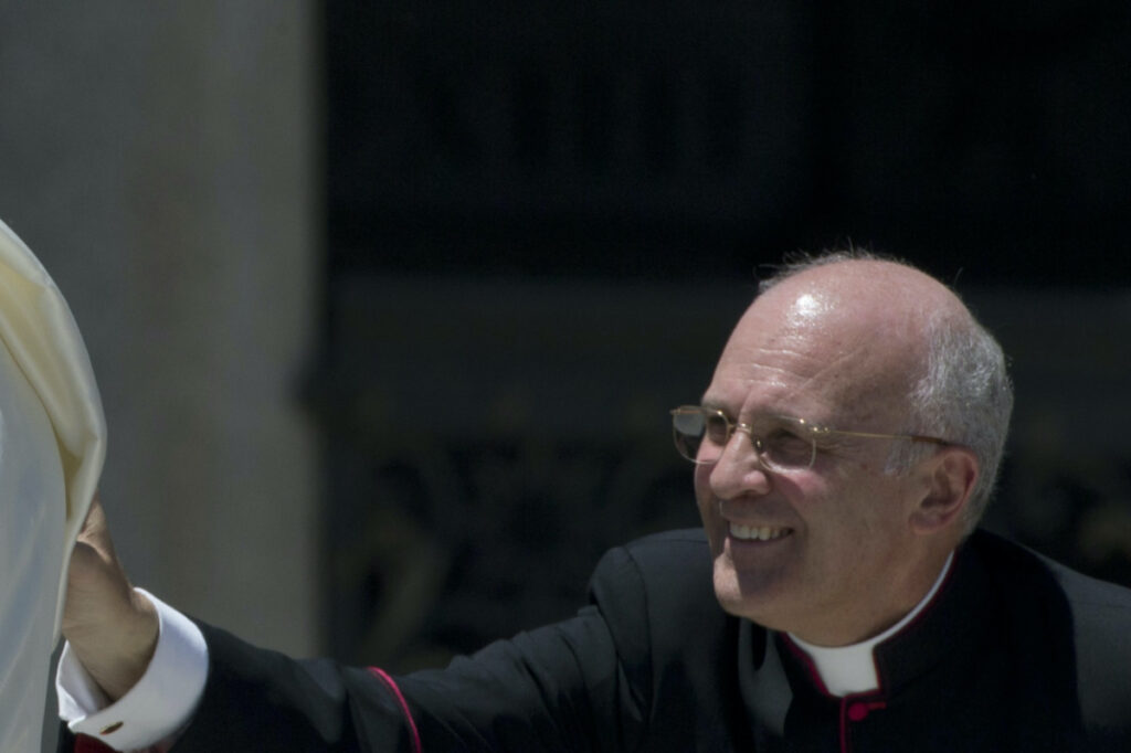 Monsignor Alfred Xuereb adjusts Pope Francis' cape as he leaves St Peter's square at the Vatican after his weekly general audience June 12, 2013. Retired Pope Benedict XVI’s other secretary Archbishop Alfred Xuereb, came out with a new memoir Thursday Feb 9, 2023