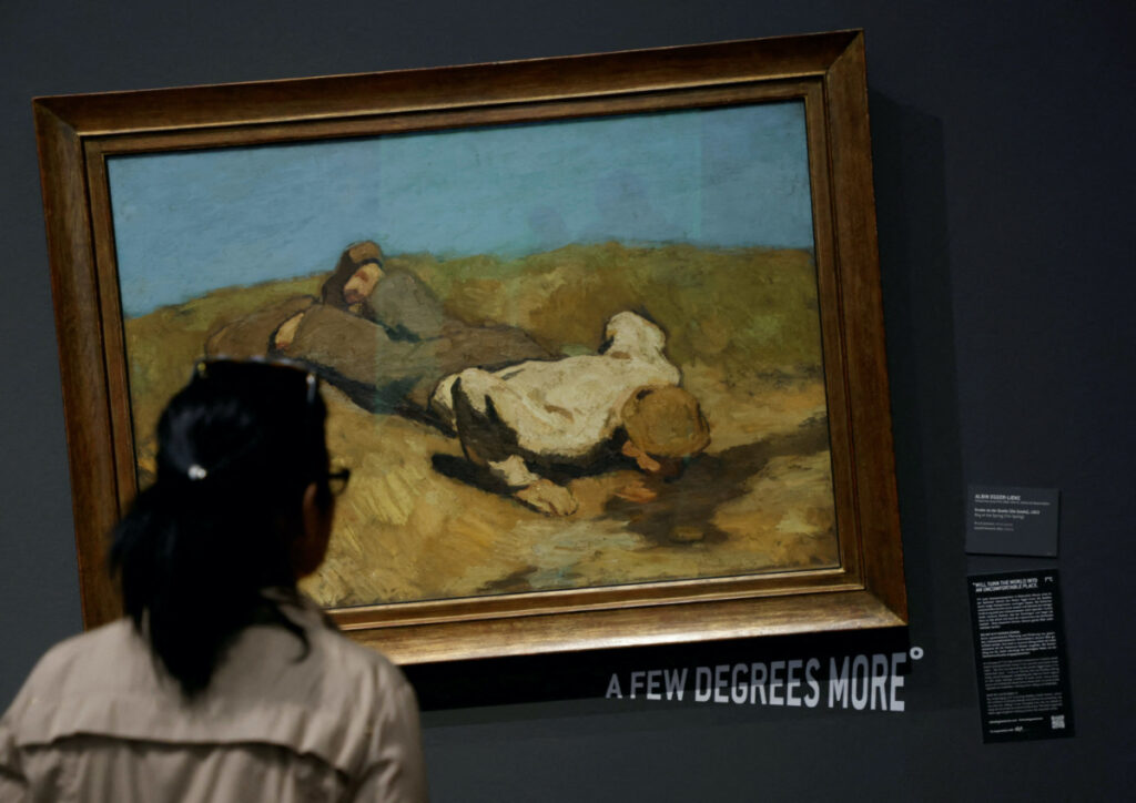 A visitor of the Leopold museum looks at the painting, A boy at the spring, by Albin Egger Lienz after the museum tilted 15 of its paintings in protest of climate change in Vienna, Austria, on 22nd March, 2023.