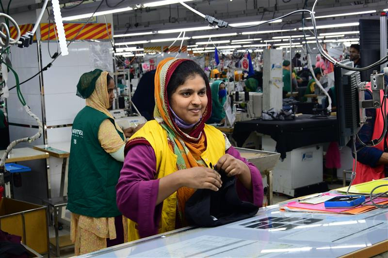 Shefali Akter works at a Snowtex Outerware garment factory in Dhamrai, Bangladesh, January 30, 2023. Thomson Reuters Foundation/Mosabber Hossain