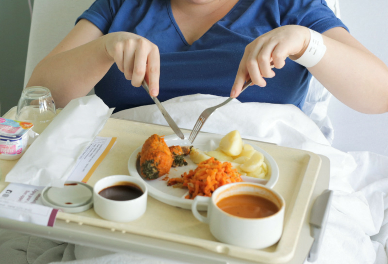 A patient eats her lunch prepared at AZ Groeninge Hospital in Kortrijk, Belgium March 13, 2023. REUTERS/Clement Rossignol