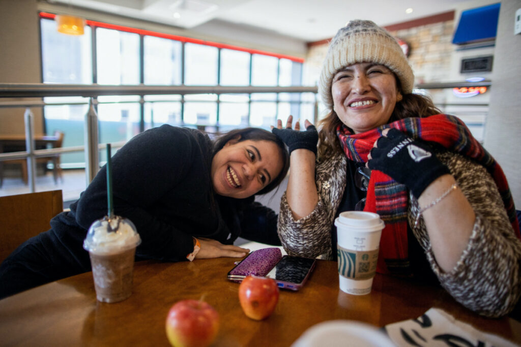 Zulema Diaz and Maryangel Diaz, two Latino women who crossed from the U.S. border to Roxham Road in Quebec, order coffee at a hotel, in Niagara Falls, Ontario, Canada March 7, 2023.