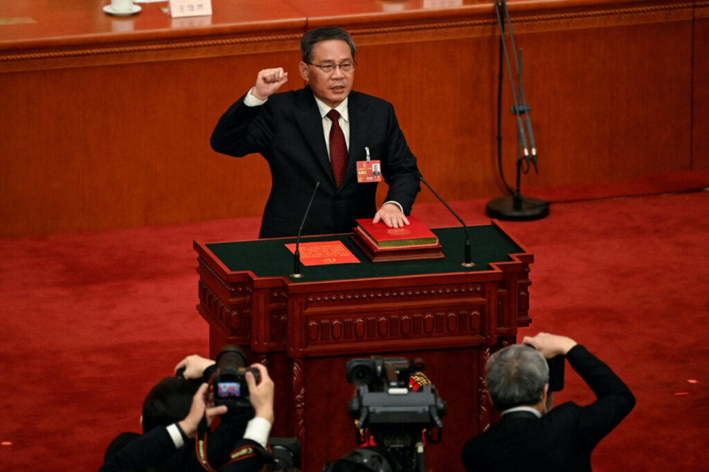 China's newly-elected Premier Li Qiang takes an oath after being elected during the fourth plenary session of the National People's Congress at the Great Hall of the People in Beijing, China on March 11, 2023.