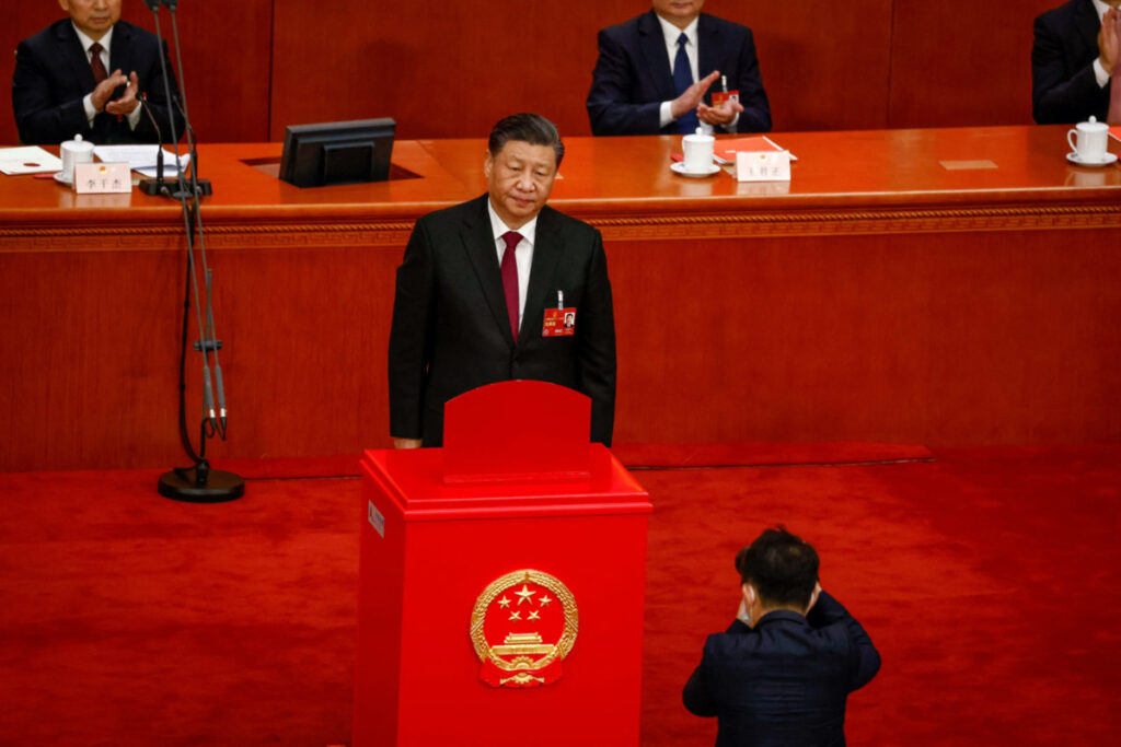 Chinese President Xi Jinping looks on after casting his vote during the Third Plenary Session of the National People's Congress at the Great Hall of the People, in Beijing, China, 10 March 2023. MARK R. CRISTINO/Pool via REUTERS