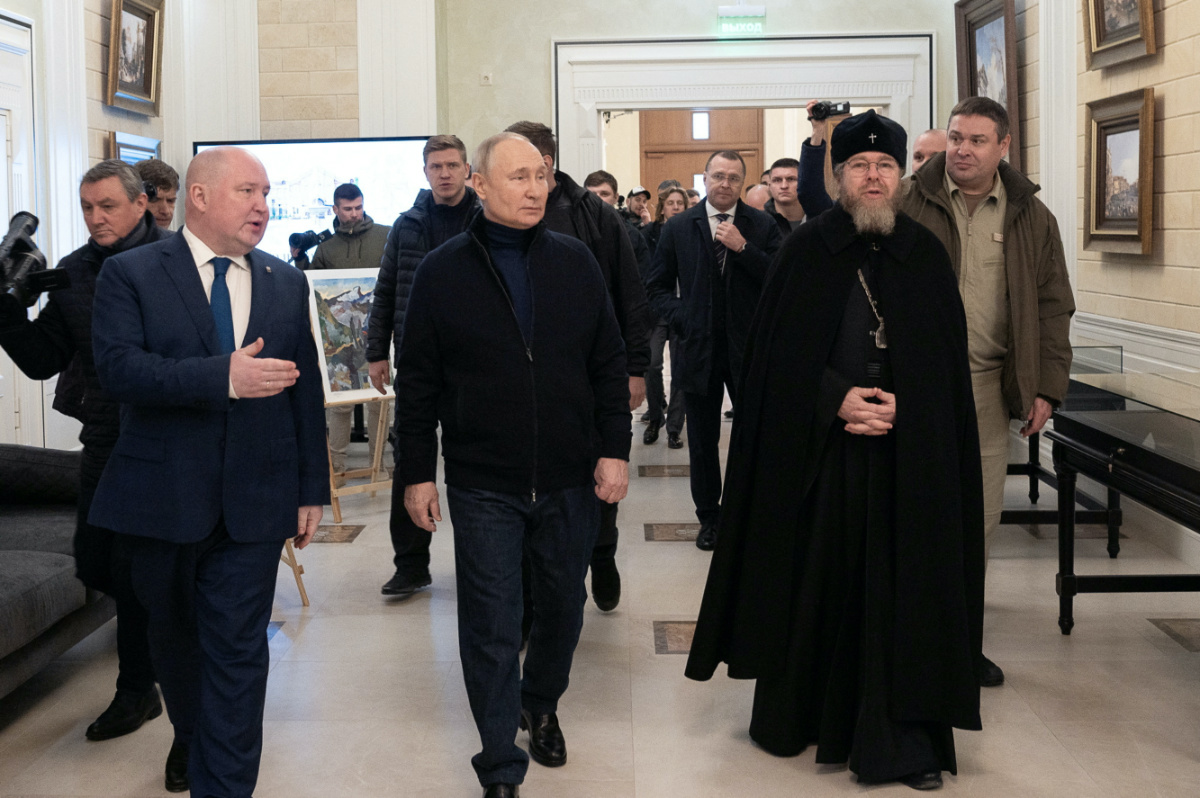 Russian President Vladimir Putin, accompanied by Governor of Sevastopol Mikhail Razvozhayev and Metropolitan Tikhon, chairman of the Patriarchal Council for Culture, visits a children's arts and aesthetic centre in Sevastopol, Crimea, on 18th March, 2023
