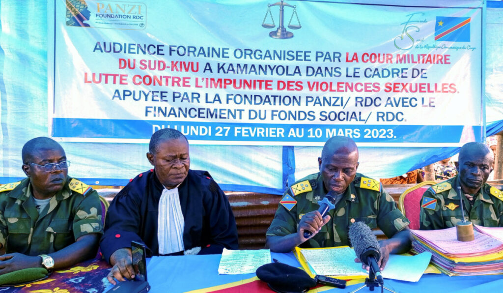 Congolese magistrates attend the military court, where members of the Armed Forces of the Democratic Republic of the Congo suspected of rape stand trial, at a makeshift courtroom in the village of Mangombe, Kamanyola in eastern Democratic Republic of Congo, on 9th March, 2023.