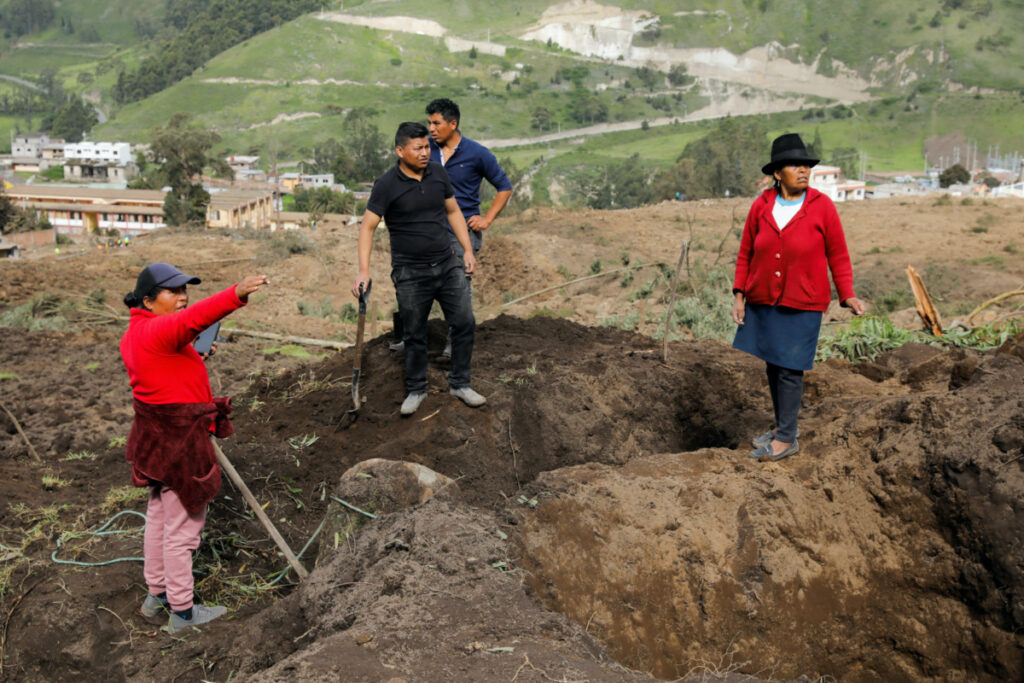 People dig amid debris as they look for relatives, following a landslide, in Alausi, Ecuador, on 28th March, 2023.