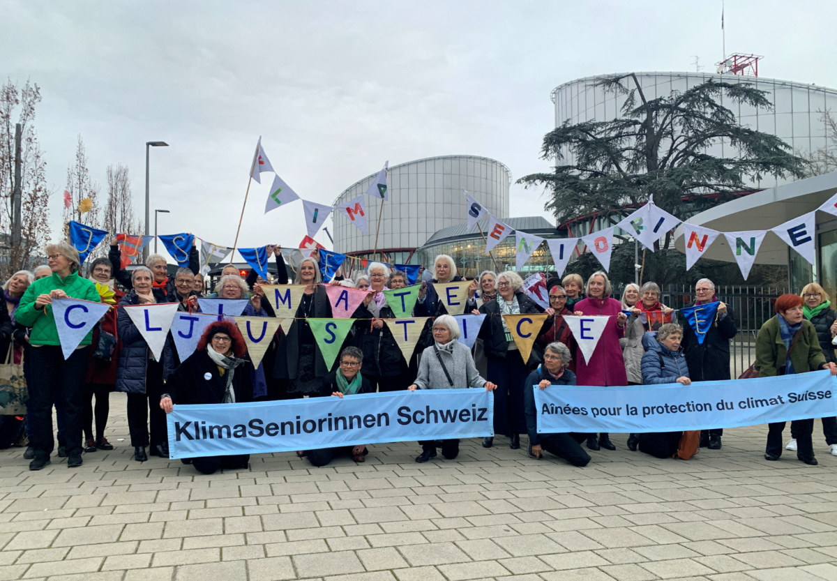 A group from the Senior Women for Climate Protection association hold banners outside the European Court of Human Rights in Strasbourg, France, on 29th March, 2023.