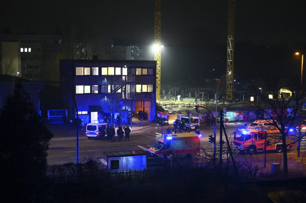 Armed police officers and emergency services near the scene of a shooting in Hamburg, Germany on Thursday March 9, 2023 after one or more people opened fire in a church.
