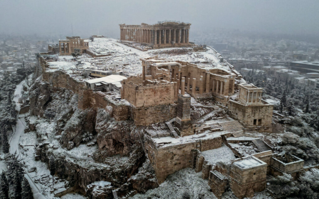 FILE PHOTO: A view of the Parthenon temple atop the Acropolis hill, during snowfall in Athens, Greece, February 6, 2023. REUTERS/Alkis Konstantinidis/