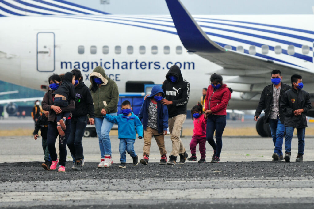 Guatemalan unaccompanied minors walk on the tarmac after arriving on a deportation flight from Mexico, at the Guatemalan Air Force (FAG) headquarters in La Aurora International Airport, in Guatemala City, Guatemala March 8, 2023. REUTERS/Sandra Sebastian