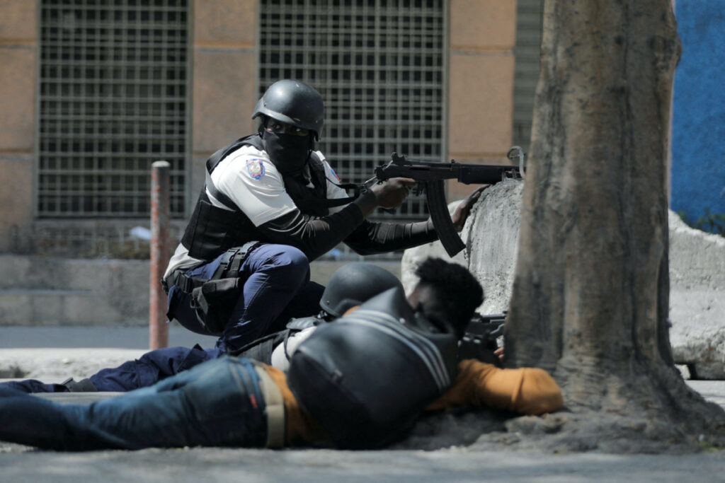A police officer takes position during an anti-gang operation amid gang violence in Port-au-Prince, Haiti, on 3rd March, 2023.