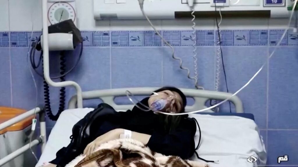 FILE PHOTO: A young woman lies in hospital after reports of poisoning at an unspecified location in Iran in this still image from video from March 2, 2023. WANA/Reuters TV via REUTERS