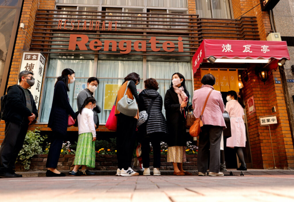 People form a line as they try to have lunch at Rengatei, a popular and long-established restaurant specialising in Japanese-style Western dishes, at Ginza district in Tokyo, Japan March 16, 2023. REUTERS/Issei Kato