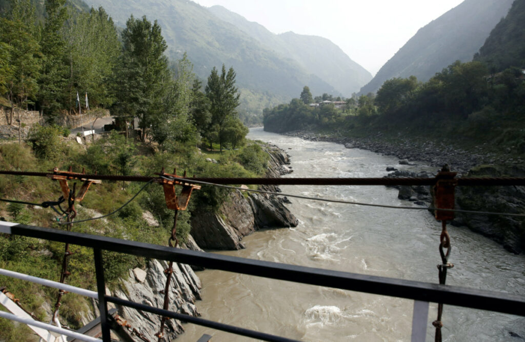 FILE PHOTO: Neelam river flows between Pakistan administered Kashmir and Indian administered Kashmir in Teetwal in north Kashmir's Kupwara district August 9, 2022. REUTERS/Danish Ismail
