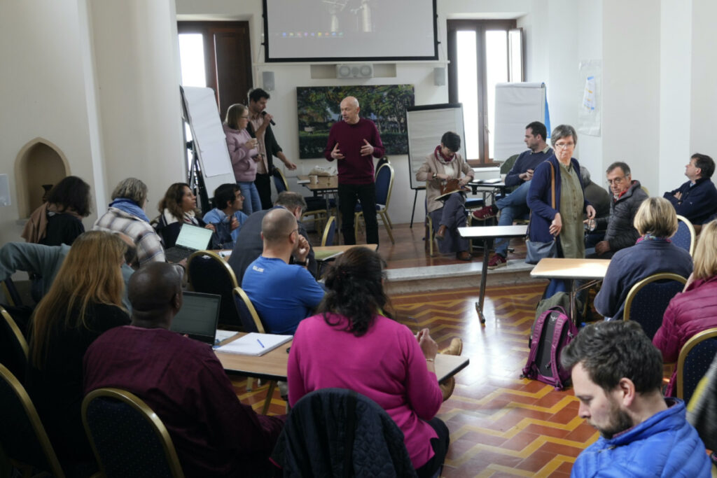 Stephan Posner, background centre, the International Leader of L'Arche, an International charity that helps people with intellectual disabilities, starts a meeting with regional leaders of the community in Rocca Di Papa, near Rome, on Wednesday, 22nd March, 2023.