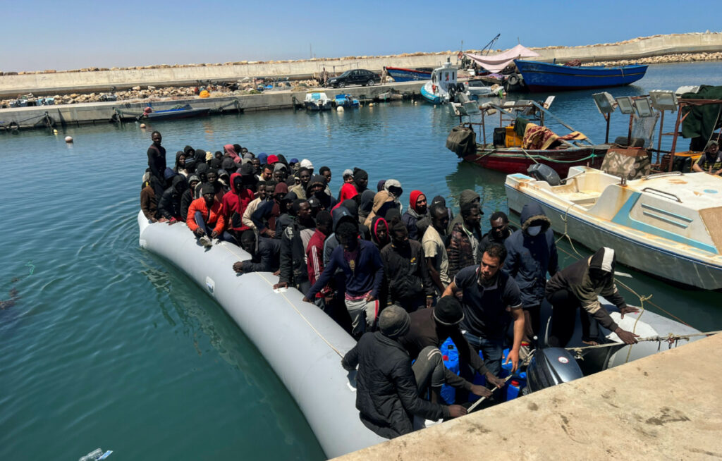 FILE PHOTO: Migrants rescued by the Libyan Coast Guards in the Mediterranean Sea arrive in Garaboli, Libya, May 23, 2022. REUTERS/Hazem Ahmed