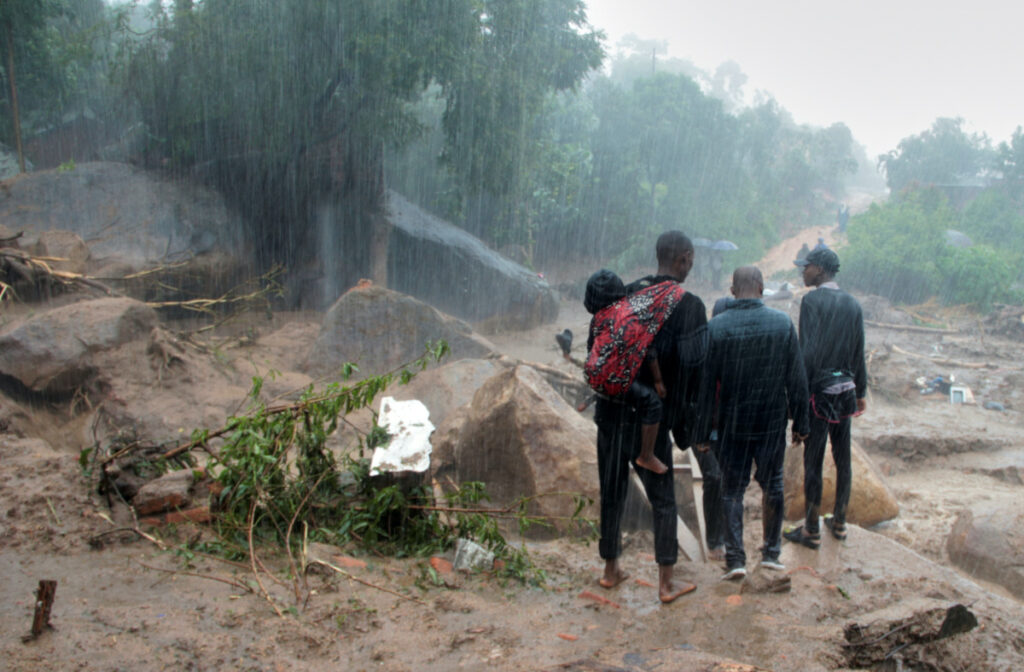 People look at the damage caused by Cyclone Freddy in Chilobwe, Blantyre, Malawi, March 13, 2023.
